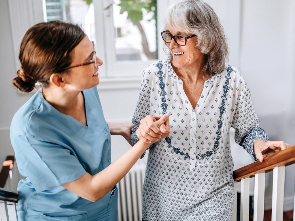 Elderly woman with nurse