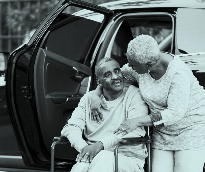 Senior on a wheelchair is being transported to medical appointments through the Partners Multipurpose Senior Services Program. 